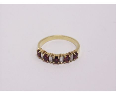 A DIAMOND AND RUBY HALF HOOP RING unmarked, the five round cut rubies with baguette diamonds in between, finger size O 1/2, 3