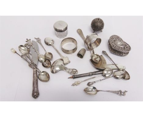 A COLLECTION OF SILVER ITEMS including: a late Victorian heart shaped box; a caddy spoon; a preserve spoon; and two napkin ri