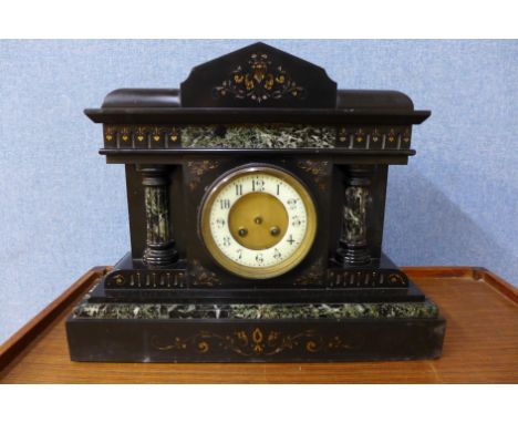 A 19th Century French Belge noir mantel clock