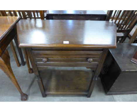 An oak single drawer side table