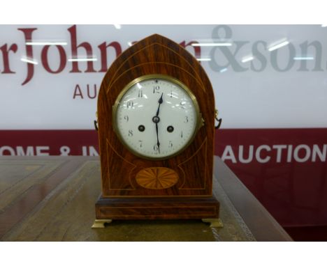 A 19th Century French inlaid rosewood lancet mantel clock, the movement signed AD Mougin, Paris