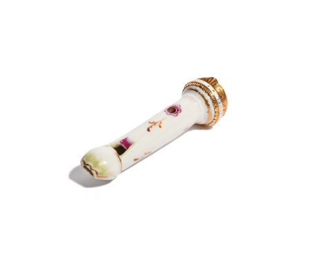 A gold-mounted English porcelain dog whistle late 18th/19th century, simply decorated with leaf sprigs on a white ground, the