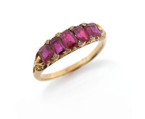 A late 19th century ruby five stone ring, set with diamond pointers in carved and pierced yellow gold mount, size P
Condition