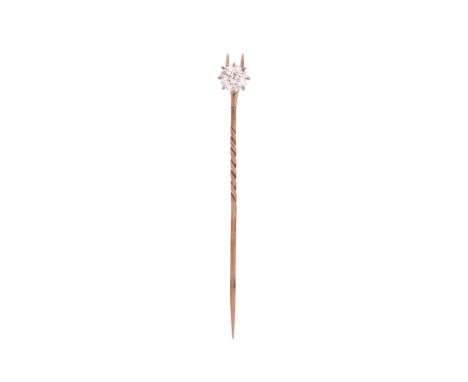 A diamond-set gold stick pin, the old circular-cut diamond weighing 1.07cts in gold, 6.8cm high Condition report:&nbsp; Diamo