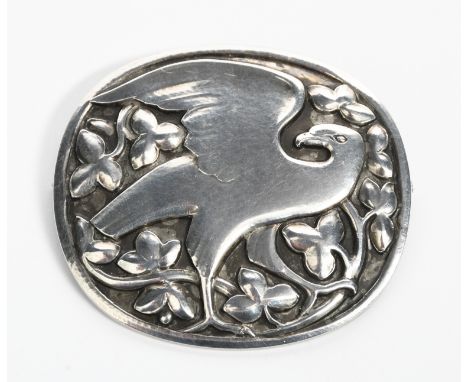 A Georg Jensen silver brooch designed by Kristian Mohl-Hansen, model no.166, rounded form stamped in low relief with a bird a