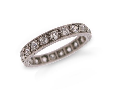 An early 20th century diamond full circle eternity ring, set with old circular-cut diamonds in platinum, size K 1/2
Condition