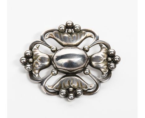 A Georg Jensen silver brooch designed by Georg Jensen, model no.173, pierced and cast with radiating flower stem design, stam