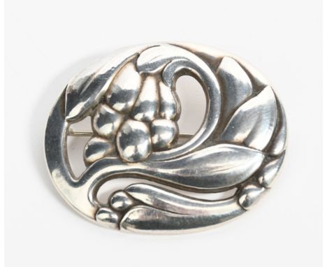 A Georg Jensen silver brooch designed by Georg Jensen, model no.65 oval pierced and cast in low relief with a bell flower ste