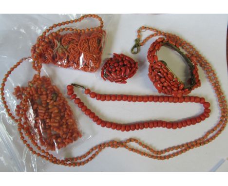 A collection of coral jewellery, to include necklaces, a brooch and a bangle