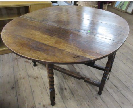 An Antique oak gateleg table, on bobbin turned legs, 47.5ins x 58.5ins, height 29ins