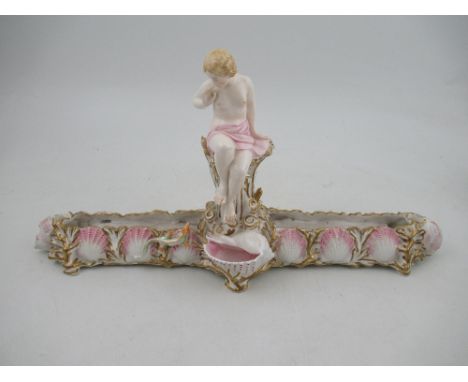 A Royal Worcester centre piece, decorated with a semi clad lady, the base decorated with shells, having registration mark to 