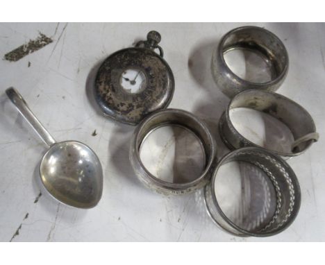 A collection of hallmarked silver to include pocket watch, napkin rings, caddy spoon etc