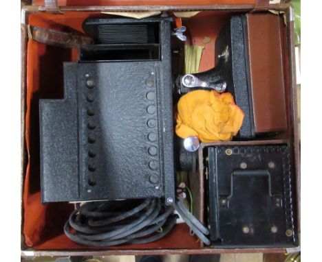 A cased tin plate magic lantern