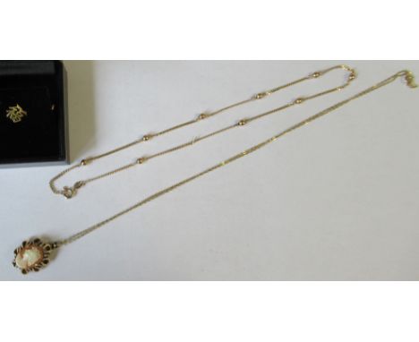 A 9ct gold fine link and ball necklace, together with a 9ct gold cameo pendant on chain and a 14k tie pin