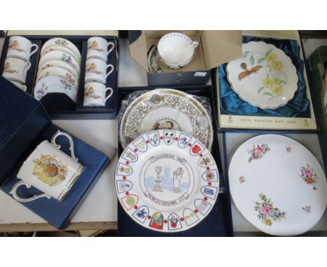 A collection of boxed Royal Worcester plates, etc