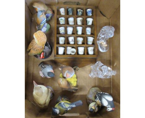 A collection of Royal Worcester bird models, together with glass models and thimbles