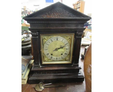 An oak cased mantel clock&nbsp;