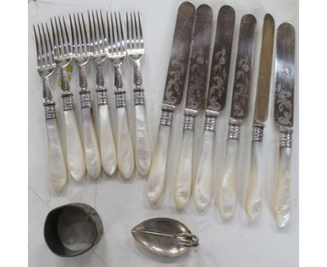 A silver leaf caddy spoon, together with a set of six mother of pearl handled fruit knives and forks and a napkin ring