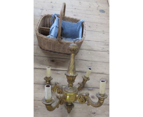 A gilt wood light fitting and a wicker basket