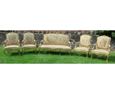 A late 19th century Louis XV style five piece salon suite, comprising a canape and four fauteils, all upholstered in Aubusson