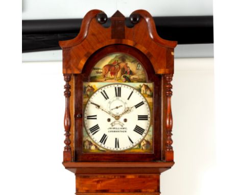 An oak and mahogany crossbanded eight-day longcase clock, Jno. Williams, Carmarthen, the painted dial with boy and horse to t