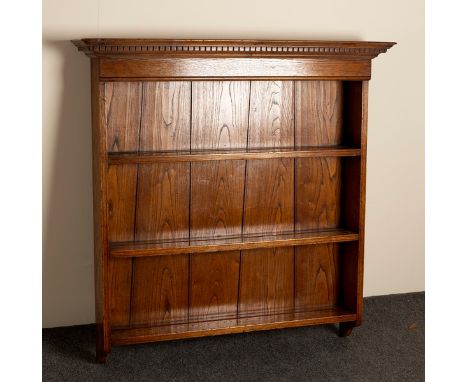 An oak hanging book shelf, 85.5cm wide and a folding table