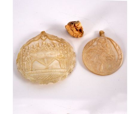 Two Jerusalem mother-of-pearl carvings, one depicting the Virgin and Child, the other the Last Supper and a Japanese netsuke 