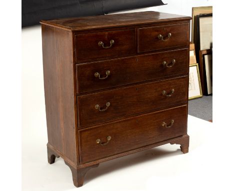 A George III oak and crossbanded chest of two short over three long drawers, on bracket feet, 108.5cm wide 
