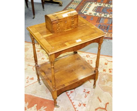 A yew wood two-tier table and a tea caddy