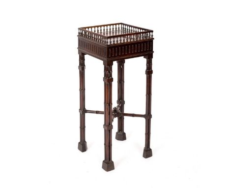 A Chippendale style mahogany square jardinière stand with gallery and raised on cluster column supports