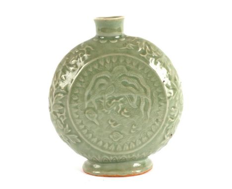 A Chinese celadon moon flask, with relief moulded decoration of phoenix to one side and dragon to the other, 17cm high/see il