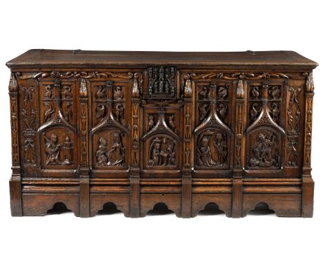 A 16th Century North German oak coffer (restorations) the rectangular plank top above five gothic panels with saints and bird