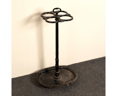 A cast iron stick stand, the four apertures to a central support set on an oval base, 66cm high/Provenance: Chorley's 24.01.0