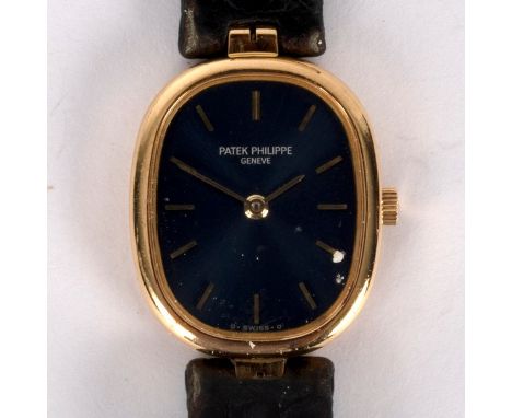 A lady's Patek Philippe watch, the blue oblong dial with gilt baton markers and hands, 18K gold cased, in box with outer box 