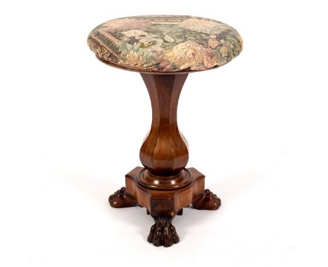 A Victorian rosewood piano stool with circular top, vase-shaped column on claw feet, 36cm diameter