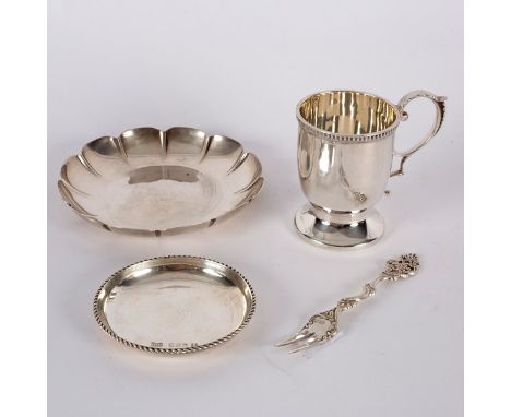 An Irish silver ashtray of strawberry dish form, A &amp; M, Dublin 1966, a silver cup, WE, Dublin 1966, a circular dish, WE, 