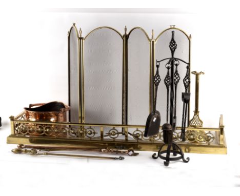 A pierced brass fire curb, a brass and wire mesh fire screen, various fire irons etc.