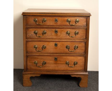 A narrow mahogany chest of four drawers on bracket feet, 56cm wide