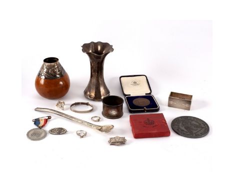 A silver vase, Sheffield 1905, of flared form, 12cm high, an Art Deco napkin ring, a mate gourd and stand and a quantity of s