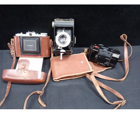 A ZEISS IKON NETTAR CAMERA, CASED a Kodak folding 'Brownie', and an Olympus 'Supertrip' (3)