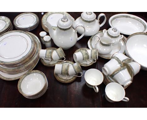 A ROYAL DOULTON 'ISABELLA' DINNER SERVICE with tea and coffee ware