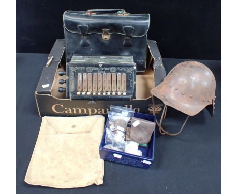A GERMAN ACCORDION, A TIN HELMET a briefcase, a quantity of coins and other items