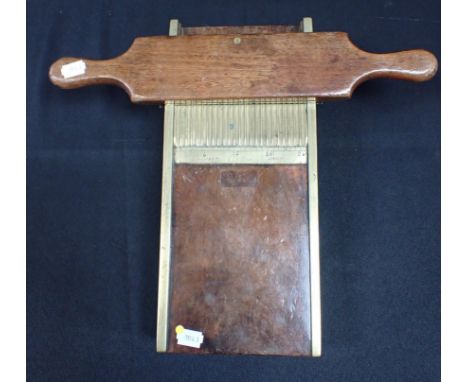 AN S. MAW &amp; SON MAHOGANY AND BRASS PILL ROLLER 