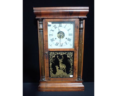 A SETH THOMAS SHELF OR WALL CLOCK with turned half columns and ogee cornice 64 x 38cm (needs attention)