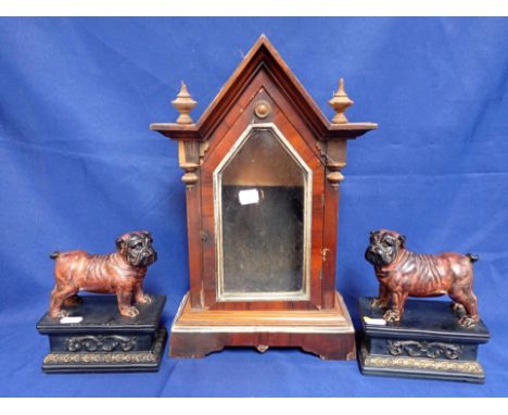A PAIR OF DECORATIVE PUGS on classical style bases (modern) 18cm high, and an American 'steeple' clock case (3)