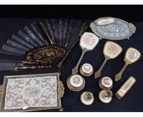 A VINTAGE LACE AND NEEDLEWORK DRESSING TABLE SET parts of another similar, and a (damaged) fan with lacquered sticks