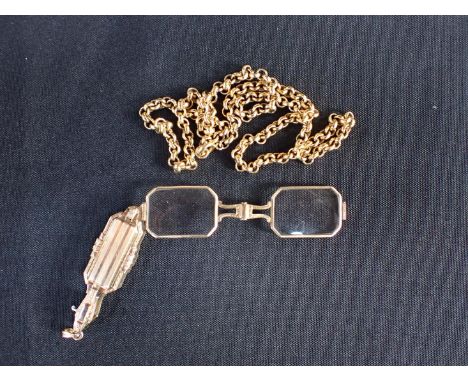 A VINTAGE FOLDING LORGNETTE PENDANT in chased gold, geometric design with engine turned and engraved detailing, suspended fro