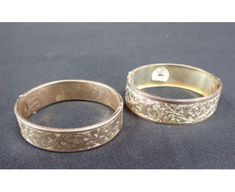 TWO BANGLES one 9ct gold. the other 9ct gold with bronze core