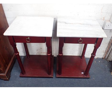 A PAIR OF WHITE MARBLE-TOPPED SIDE TABLES fitted a drawer, with shelf under, each 40cm wide (one top repaired)