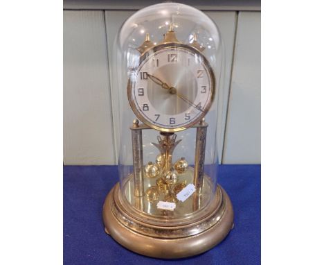A GERMAN 400 DAY 'ANNIVERSARY' CLOCK under a 25cm glass dome